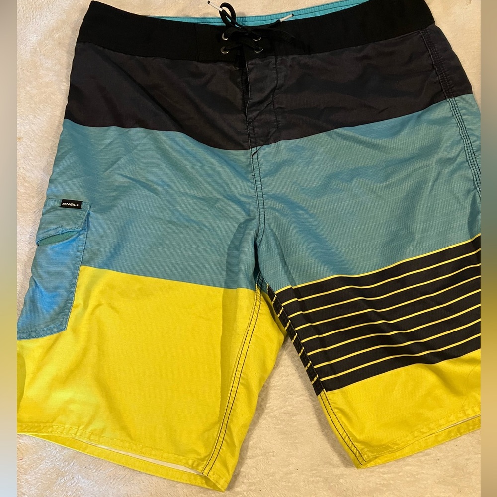 O’Neill Board shorts in size 34; black, teal, and yellow